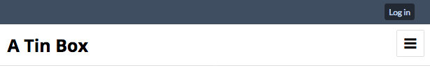A blue bar across the top of the image only has a small button reading "Log In". Below this, the site's title "A Tin Box" is displayed in black text on a white background.